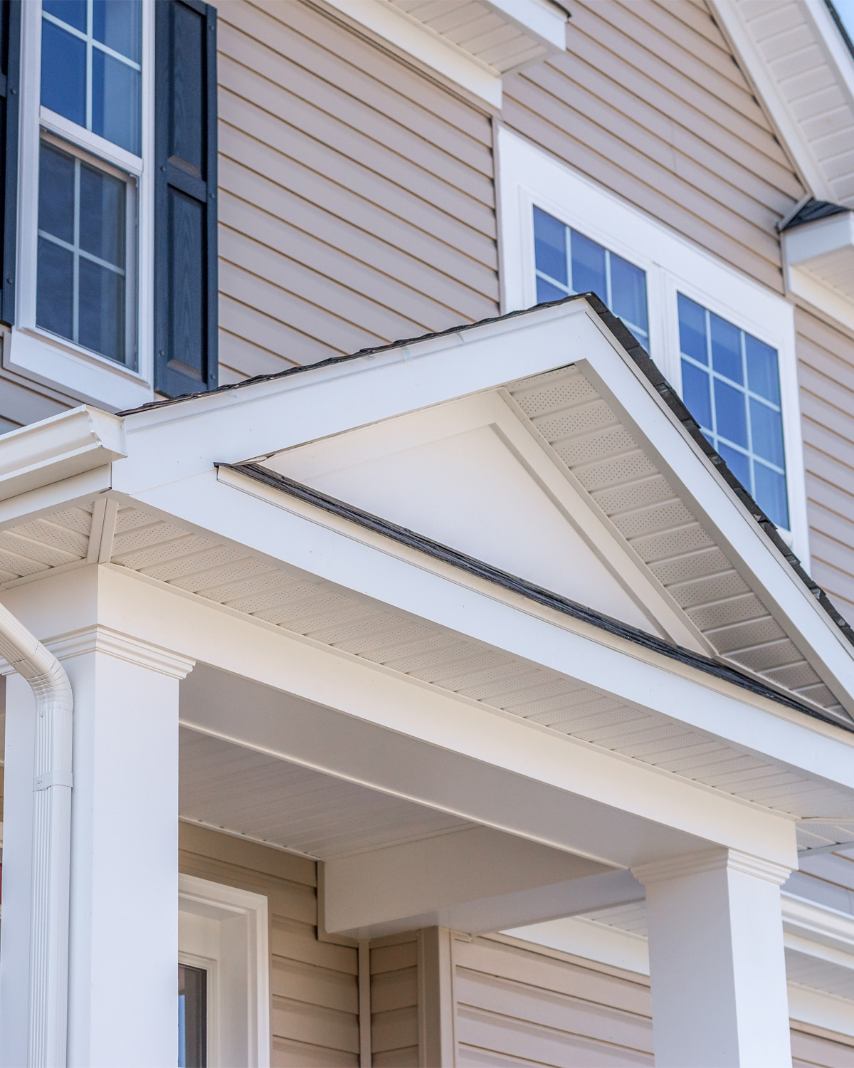 Ottawa exterior renovation with vinyl siding, soffit and fascia replacement on residential property.